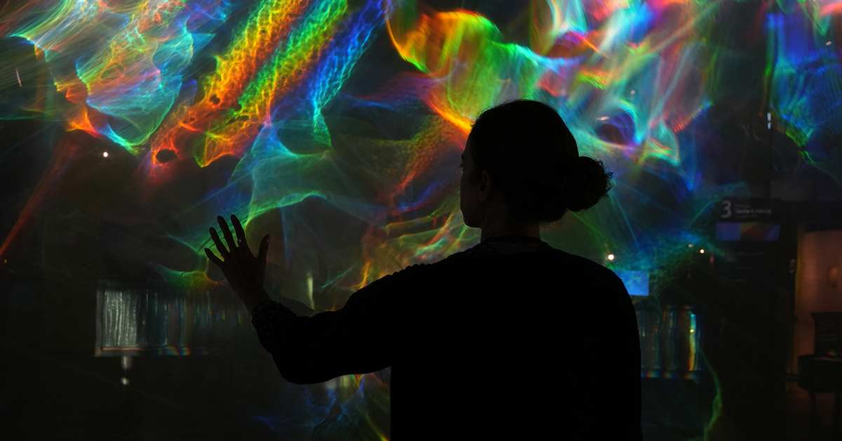 Person reaching into immersive color